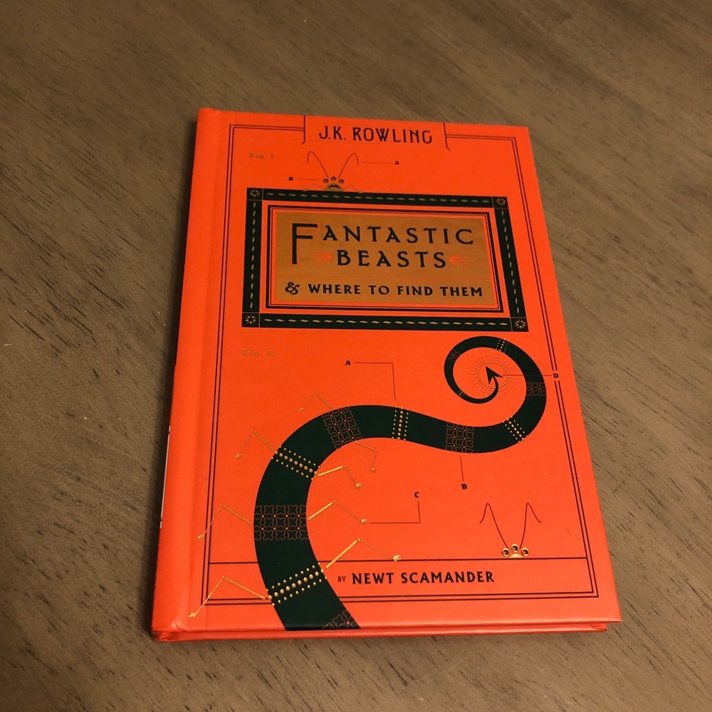 J.K. Rowling Fantastic Beasts Book in Orange Cover